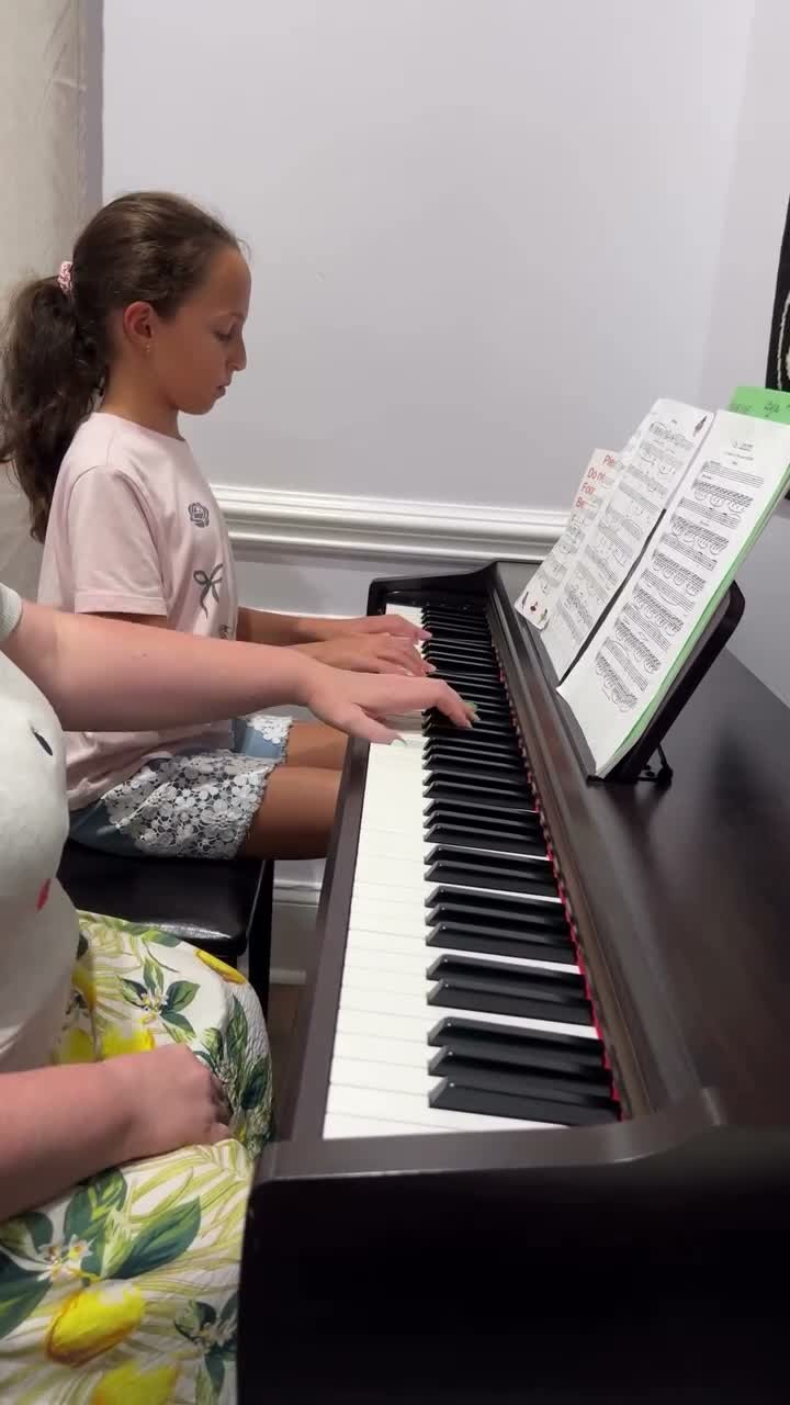 A young student at her piano lesson at Virtuoso School of Music and Art in Charlotte, NC
